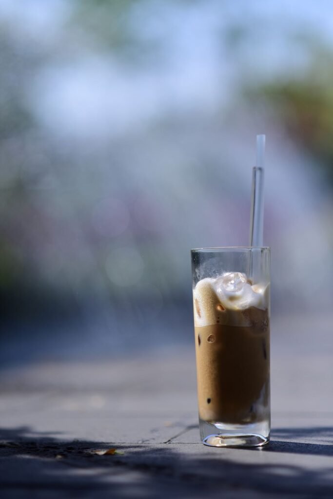 A generic glass of iced coffee with cream
